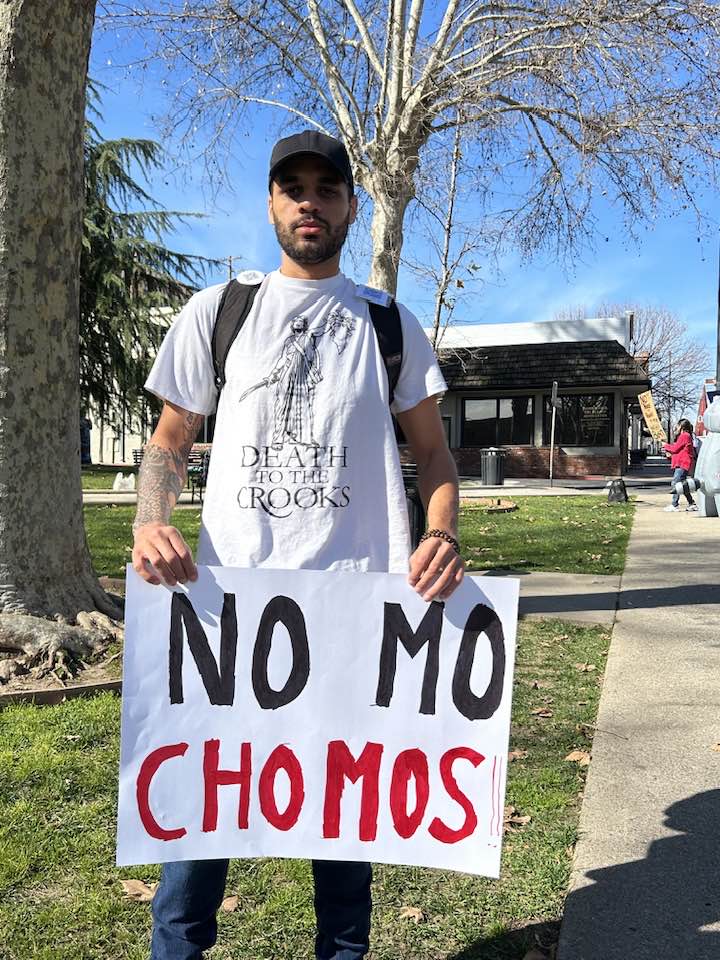 Photo by Laurie Sylwester. Sign that says Chomo which is short for child molester.